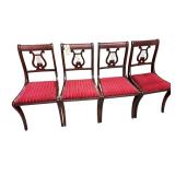 FOUR VINTAGE WOODEN DUNCAN-PHYFE STYLE CHAIRS FEATURING HARP-SHAPED BACKRESTS AND RED STRIPED UPHOLSTERED SEATS