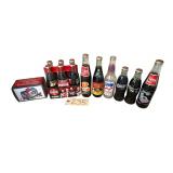 ASSORTMENT OF COLLECTIBLE GLASS SODA BOTTLES: SIX-PACK COCA-COLA NASCAR EDITION FEATURING DALE EARNHARDT JR., UNIV. TENNESSEE COCA-COLA, TENNESSEE HOMECOMING 1986 COCA-COLA, 2X RC COLA, 1X PEPSI; COCA