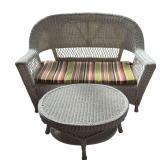 WHITE WICKER SOFA - APPROX. 52” FROM OUTER ARM TO OUTER ARM X 37” TALL; OVAL WHITE WICKER COFFEE TABLE