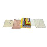APPROX. 58” X 50” CHILD’S QUILT, 2 PIECE CHENILLE BATHROOM RUG SET, LACE TABLECLOTH, BEDSPREAD, FLORAL SHOWER CURTAIN (SOME STAINING)
