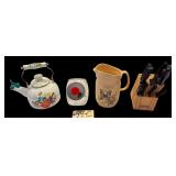 WOODEN FARBERWARE KNIFE BLOCK W/ SCISSORS AND KITCHEN KNIVES OF ASSORTED BRANDS, THE PIONEER WOMAN TEA KETTLE, STONEWARE BUTTERFLY PATTERN PITCHER, TILTED GLASS CANDY JAR