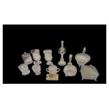 11 PIECES OF CLEAR PATTERN GLASS: 2 FOOTED CANDY DISHES W/ LIDS (ONE HAS BEEN REPAIRED), 2 SUGAR DISHES, 2 CANDLEHOLDERS, FOOTED BOWL, 2 FOOTED VASES, CANDY JAR W/ LID