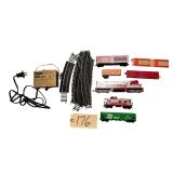 TYCO TRAIN POWER PACK, SMALL ASSORTMENT OF TRACK, SILVER STREAK 4301 ENGINE, SILVER STREAK CABOOSE, 3 ROLLING STOCK TRAIN CARS, 2 FLATBED TRAIN CARS - HO SCALE