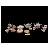 APPROX. 22 PIECES OF ROYAL ALBERT LADY GARGOYLE PATTERN: 4 DESSERT PLATES, 6 SALAD PLATES, 4 CUPS, 3 SAUCERS, TRIVET, COFFEE POT, TEAPOT, CREAM AND SUGAR; SANDRA’S ROSE GRACIE BONE CHINA PITCHER W/ 