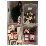 4 PLASTIC STORAGE TOTES W/ LIDS CONTAINING ASSORTED CHRISTMAS DECOR TO INCLUDE ARTIFICIAL WREATH W/ WHITE POINSETTIAS AND PINECONES, ARTIFICIAL GARLAND, SMALL DECORATED CHRISTMAS TREE, SANTA CLAUS FIG