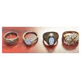 STERLING SILVER 925 RING LOT: 4 RINGS TO INCLUDE VINTAGE AVON STERLING SILVER RING FEATURING A PRONG-SET PEAR OR MARQUISE-CUT LAVENDER GEMSTONE ON A SPLIT-SHANK BAND, CAMEO, CLUSTER, AND BAND. TOTAL A