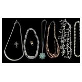 VINTAGE COSTUME JEWELRY LOT TO INCLUDE FAUX PEARL NECKLACES, JADE PENDANT W/ SILVER TONE NECKLACE, FANCY “JM” NECKLACE W RHINESTONE TYPE STONES, OTHER NECKLACE, CROSS PENDANT, STONE PENDANT