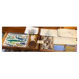 ASSORTMENT OF PLACEMATS, DOILIES, HOT PLATES, TABLECLOTHS, NAPKINS, COOKBOOKS, AND NEEDLE POINTS