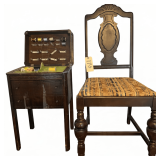 VINTAGE WOODEN SEWING CABINET W/ HINGED LID, THREAD SPOOL HOLDERS, INTERIOR STORAGE,  AND 2 DRAWERS; WOODEN SEWING CHAIR W/ CARVED DECORATIVE BACK, UPHOLSTERED SEAT, AND TURNED FRONT LEGS
