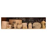 ASSORTED HOME DECOR TO INCLUDE: EIFFEL TOWER DECORATIVE WASTEBASKET, DECORATIVE COFFEE MUG, WHITE CERAMIC FACE PLANTER, CERAMIC HEDGEHOG FIGURINE, WHITE EMBOSSED CERAMIC PLANTER, RAE DUNN "GATHER" CAN