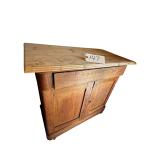VINTAGE WOODEN CABINET W/ 2 PANEL DOORS, OVERHANGING TOP, NATURAL WOOD FINISH - APPROX. 17” X 29” X 32”