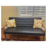 black faux leather mid-century modern style couch