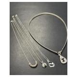 Four Sterling Chains with Pendants