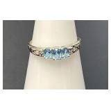 10 KT Blue Topaz and Diamond Ring