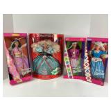 Four Boxed Barbies and One Barbie Book
