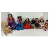 Seven Assorted Dolls and Rocking Chair