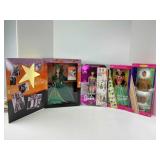 Four Boxed Barbies and Two Books