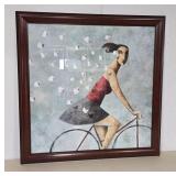Framed Artwork of Woman on Bicycle