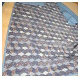 Quilt With Geometric Floral Pattern