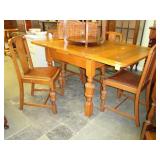 Oak, draw leaf table with four matching dining