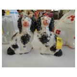 Pair of small black and white Staffordshire dogs,