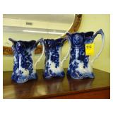Three graduated, flow blue jugs, ca. 1900