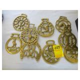 Nine horse brasses