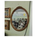 Oval, gilt, wall mirror