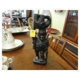 Carved figure of a hunter with an elephant