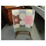 Hand made quilt along with a stand