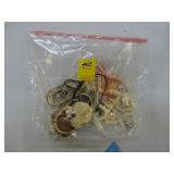 Bag of various white necklaces, including