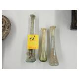 Three ancient glass bottles