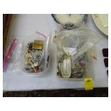 Two tubs containing various costume jewelry