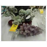 Amethyst grapes, along with jade Foo Dogs