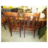 Seven piece oak dining table and chairs with two
