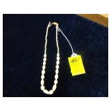 Carved, beaded necklace