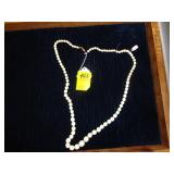 Longer carved, beaded necklace