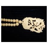 Carved phoenix and dragon necklace