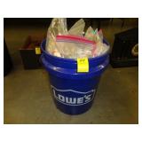 Blue Lowe's bucket full of various costume