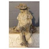 Girl Sitting on Dress With Hat Statue