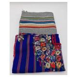 Embroidered Textile and Striped Blanket