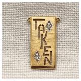 14K Gold TAKEN Pendant w/ Diamonds