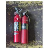 Two Red Fire Extinguishers