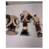 Three Santa Figurines