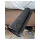 Rolled Black Rubber Rug