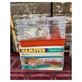 New hamster cage in box, includes bedding.