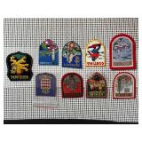 Collection of vintage travel souvenir patches from various European destinations