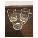 Three glass beer mugs.