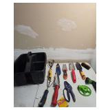 Tote full of gardening tools