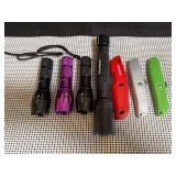 Four flashlights and three retractable blade utility knives